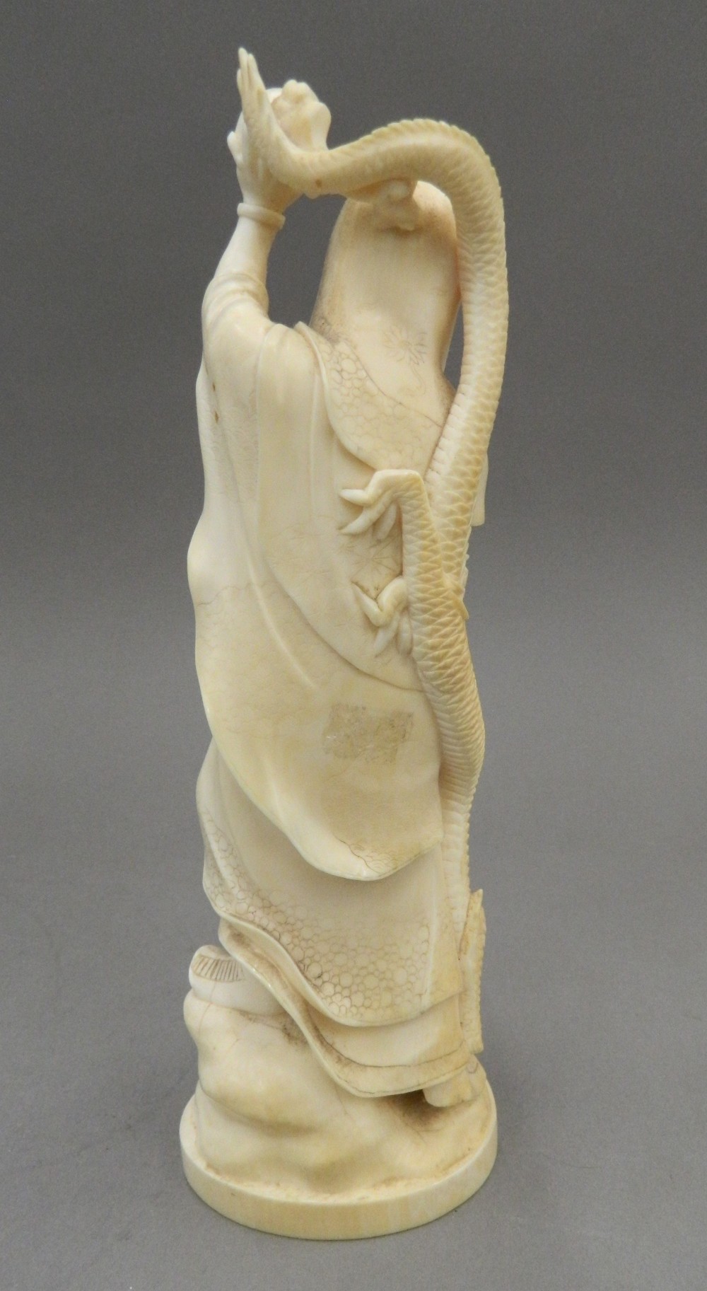 A late 19th century Japanese carved okimono Formed as a robed figure and a dragon, - Image 3 of 13