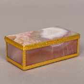 An unmarked gold mounted agate snuff box Of hinged panelled rectangular form. 8.75 cm wide.
