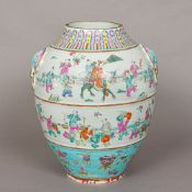 A 19th century Chinese porcelain vase Of bulbous form, with twin mask and loop handles,