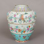 A 19th century Chinese porcelain vase Of bulbous form, with twin mask and loop handles,