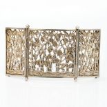A Chinese unmarked white metal buckle Of three panel form, each with pierced bamboo decoration. 11.