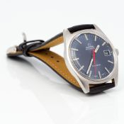 A 1960s gentleman's Omega Geneve quick set calendar wristwatch The blue dial set with batons and