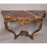 An 18th century Continental carved oak console table The red serpentine marble top above a