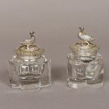 A pair of George IV silver mounted clear cut glass inkwells, hallmarked for London 1829,