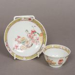 An 18th century Chinese famille jeune porcelain tea bowl and saucer Decorated with figures and
