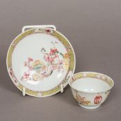 An 18th century Chinese famille jeune porcelain tea bowl and saucer Decorated with figures and