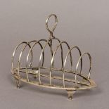 An Edward VII silver toast rack, hallmarked London 1909,