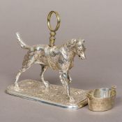 A Victorian silver plated model of a dog, set with a saddle and with loop handle,