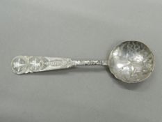 A Chinese silver spoon. 10.75 cm long (9.4 grammes).