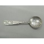 A Chinese silver spoon. 10.75 cm long (9.4 grammes).