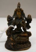 A small bronze deity. 6.5 cm high.