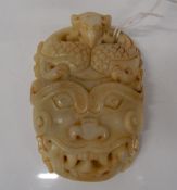 A Chinese white jade buckle. 8 x 5.5 cm.