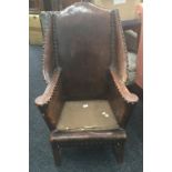 A late 19th/early 20th century leather armchair. 69 cm wide.