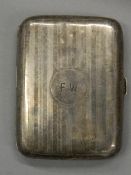 A silver cigarette case. 7 cm wide; 9.5 cm high (87.