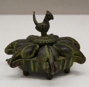 An Indian bronze spice box. 7 cm wide.