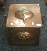 An Arts and Crafts copper coal scuttle. 41 cm wide.