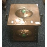 An Arts and Crafts copper coal scuttle. 41 cm wide.