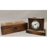 A Victorian rosewood writing slope and a Victorian inlaid mantle clock. The clock 21.5 cm high.