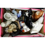 A box of various cat ornaments