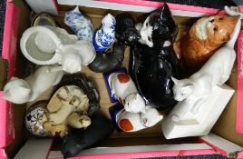 A box of various cat ornaments