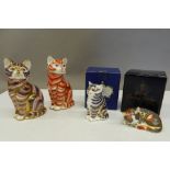 Four Royal Crown Derby cat form paperweights, two with boxes (three with stoppers),
