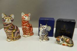 Four Royal Crown Derby cat form paperweights, two with boxes (three with stoppers),