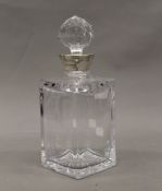 A silver mounted cut glass decanter