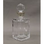 A silver mounted cut glass decanter