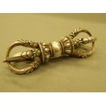 A silver vajra. 9.5 cm long.