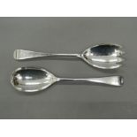 A pair of silver salad servers.
