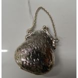 A silver purse. 4.5 cm high (19.