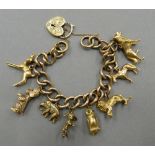 A 9 ct gold charm bracelet set with various charms (71 grammes total weight)