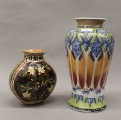 Two florally decorated vases. The largest 31 cm high, smaller 19 cm high.