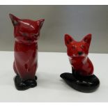 Two Royal Doulton Flambe models, a fox and a cat. The cat 13 cm high.