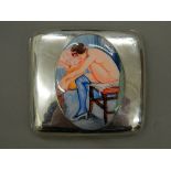 A silver cigarette case decorated with a nude lady. 9 cm wide (127.