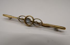 A 15 ct gold aquamarine and seed pearl bar brooch.