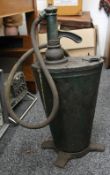 A vintage oil pump. 66 cm high.