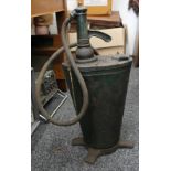 A vintage oil pump. 66 cm high.