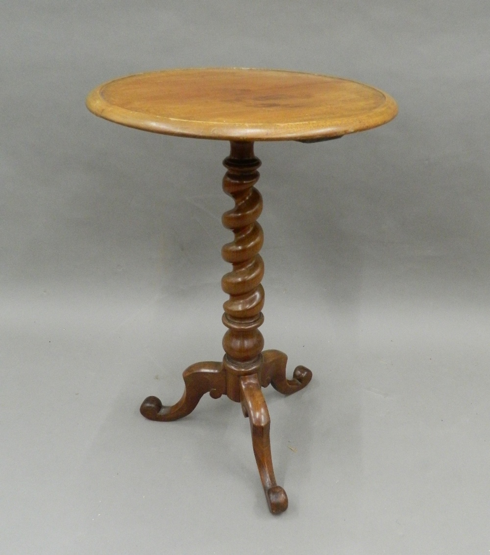 A Victorian mahogany barley twist tripod table. 47 cm diameter.