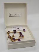 A 9 ct gold suite of jewellery, comprising of an amethyst bracelet, a pair of earrings and a ring.