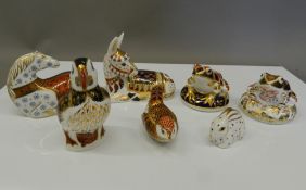 Seven unboxed Royal Crown Derby paperweights (all with stoppers), including Donkey,