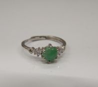 A jade and cubic zirconia ring.