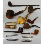 A quantity of pipes and smokers knives/tampers