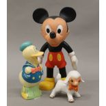 A vintage figure of Mickey Mouse, Donald Duck and a porcelain lamb. The former 24 cm high.