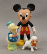 A vintage figure of Mickey Mouse, Donald Duck and a porcelain lamb. The former 24 cm high.