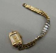 A Smiths 9 ct gold cased ladies wristwatch, inscribed to reverse Thos.