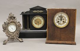 A Victorian black slate mantle clock,