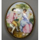 A late 19th/early 20th century Continental painted porcelain brooch. 7.75 cm high.