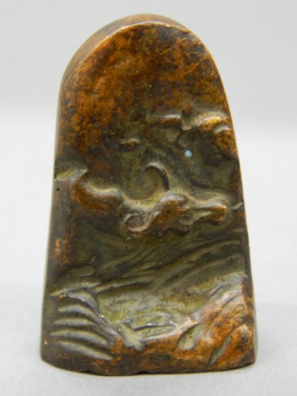 A Chinese bronze seal decorated with buffalo. 4.5 cm high.