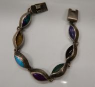 A silver multi stoned bracelet. 16 cm long (25.